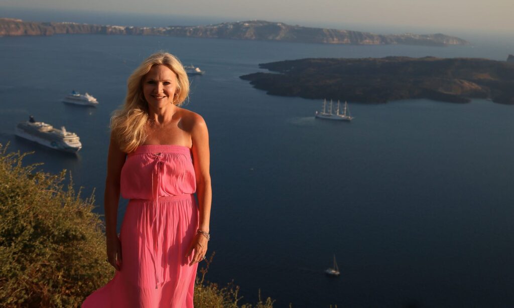 This is a picture of Kristianne Stewart standing on a mountain side in Greece.